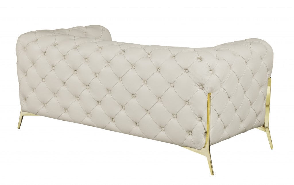 Homeroots 69" Beige All Over Tufted Italian and Gold Leather Love Seat 477573